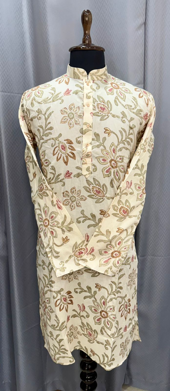 Floral patterned kurta on a mannequin against a gray background