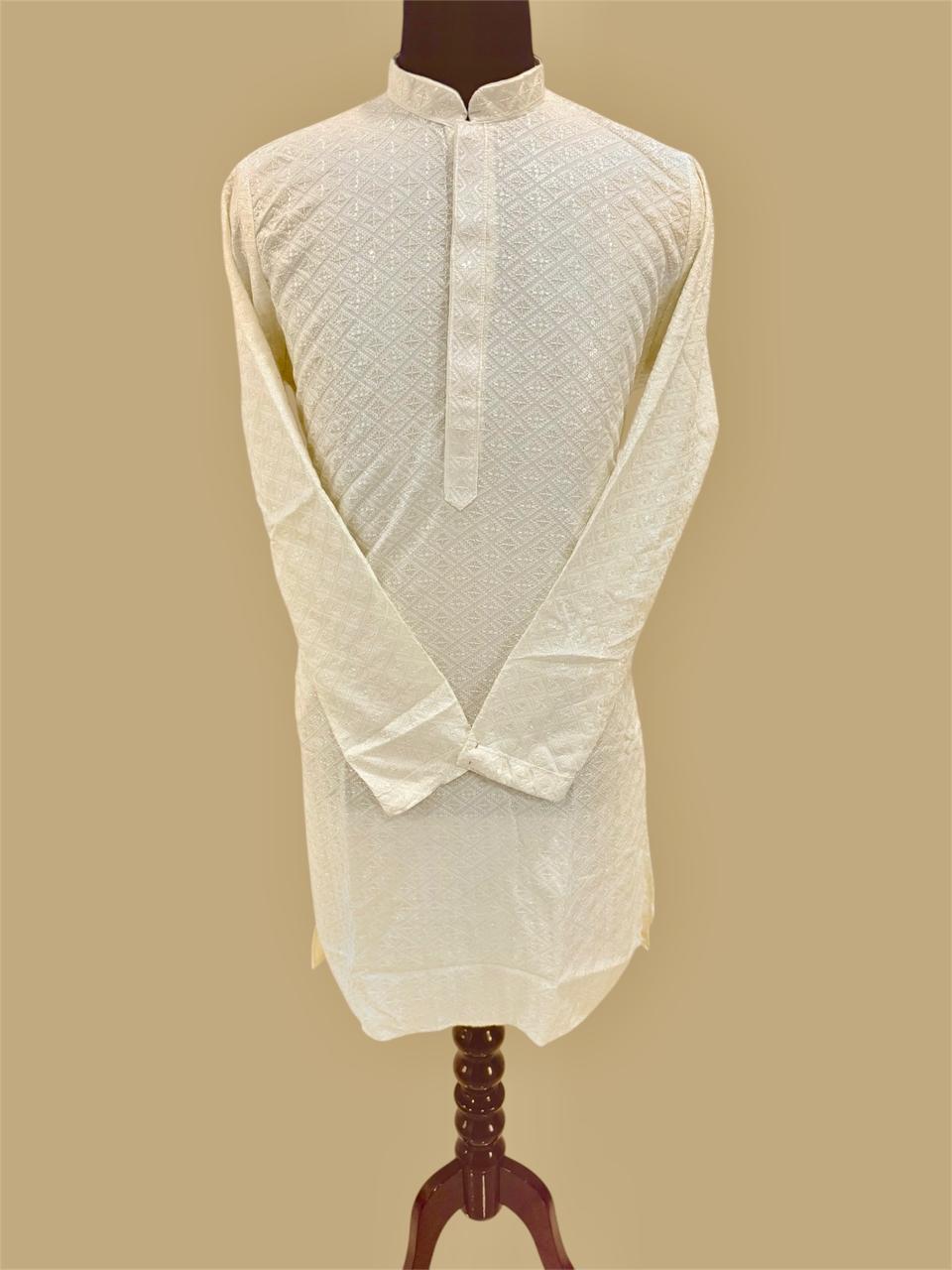 Cream traditional kurta on a mannequin against a beige background