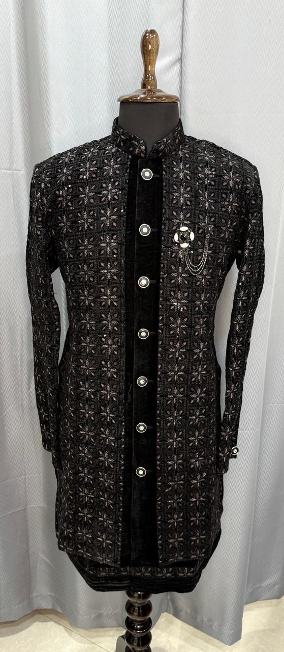 Black embroidered sherwani on a mannequin against a white background