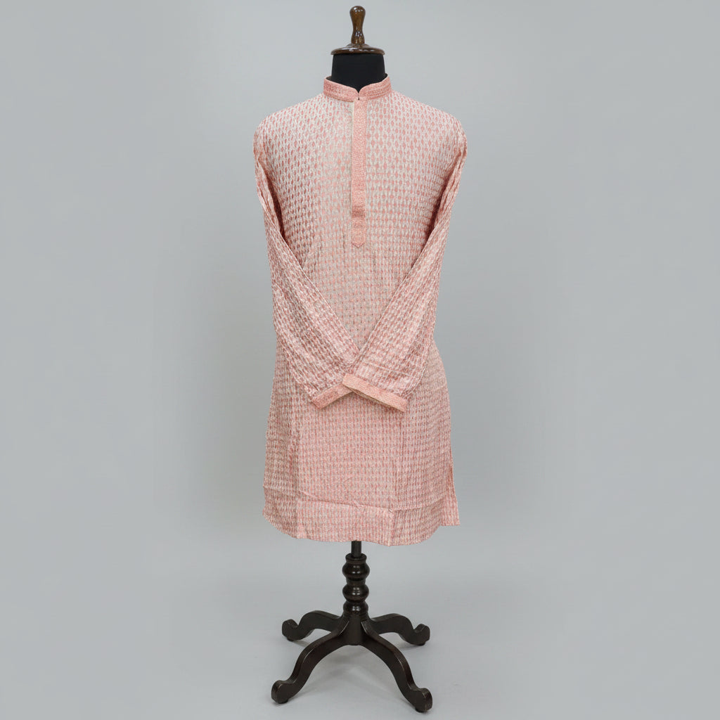 Pink textured shirt on a mannequin against a gray background