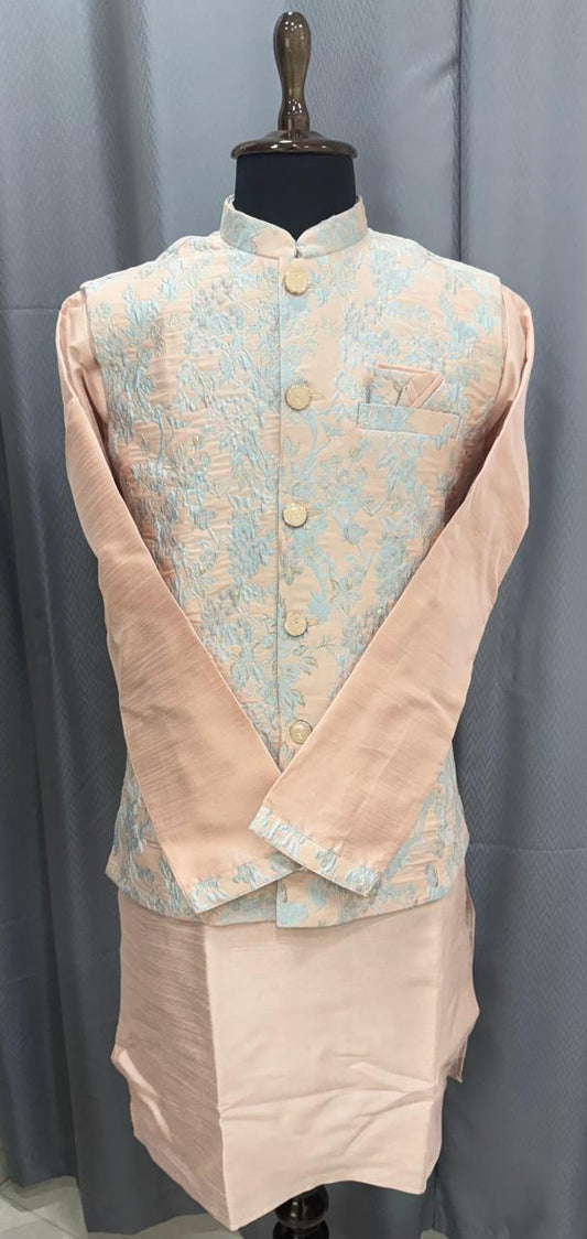 Traditional outfit with a peach light  blue embroidered vest and peach kurta on a mannequin against a gray background.