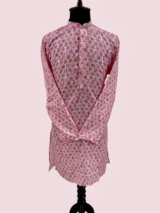 Pink floral patterned kurta on a mannequin against a light pink background