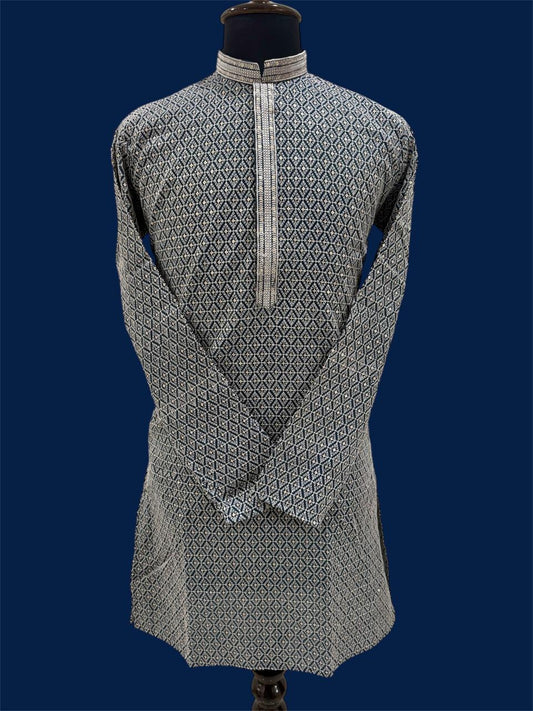 Traditional navy blue kurta with intricate patterns on a mannequin against a blue background