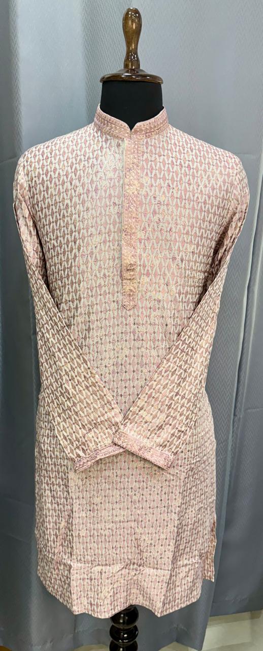 Vintage dress on a mannequin against a plain background