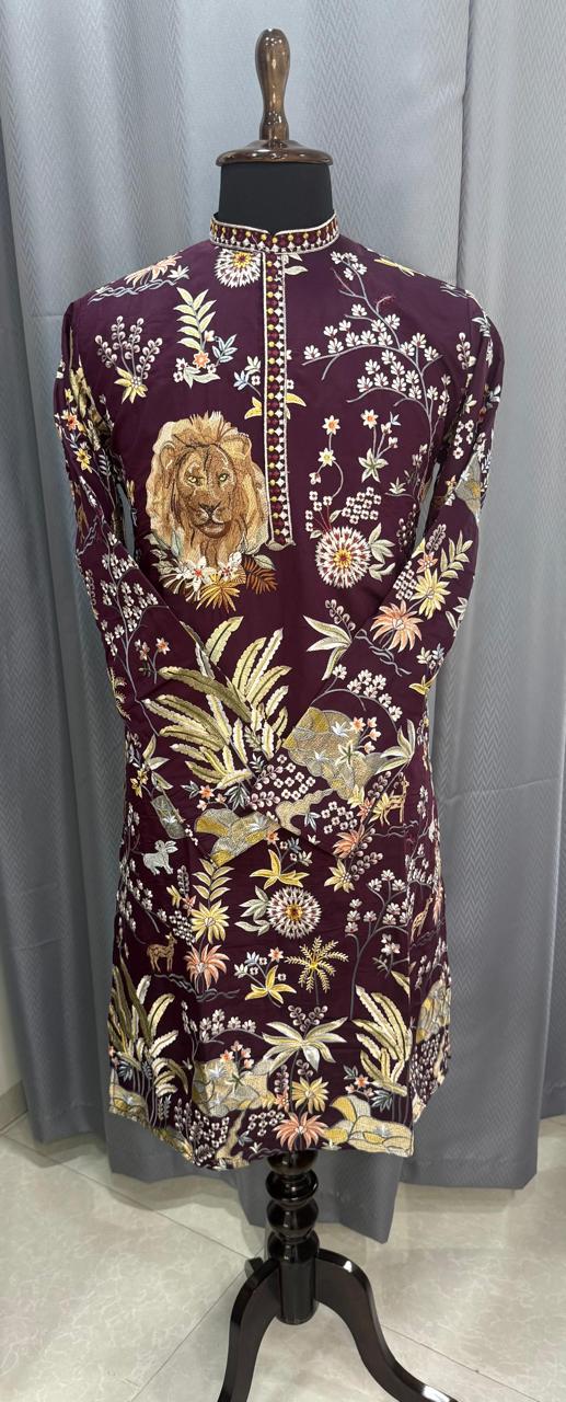 Mens Kurta with lion and floral design on a mannequin against a gray curtain background