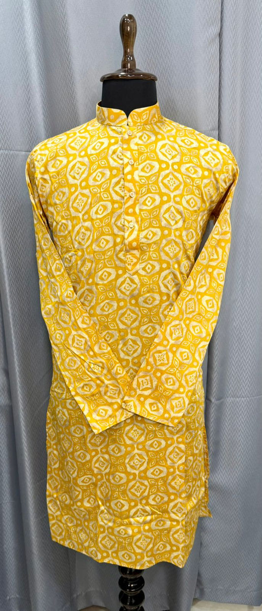 Yellow patterned kurta on a mannequin against a gray background