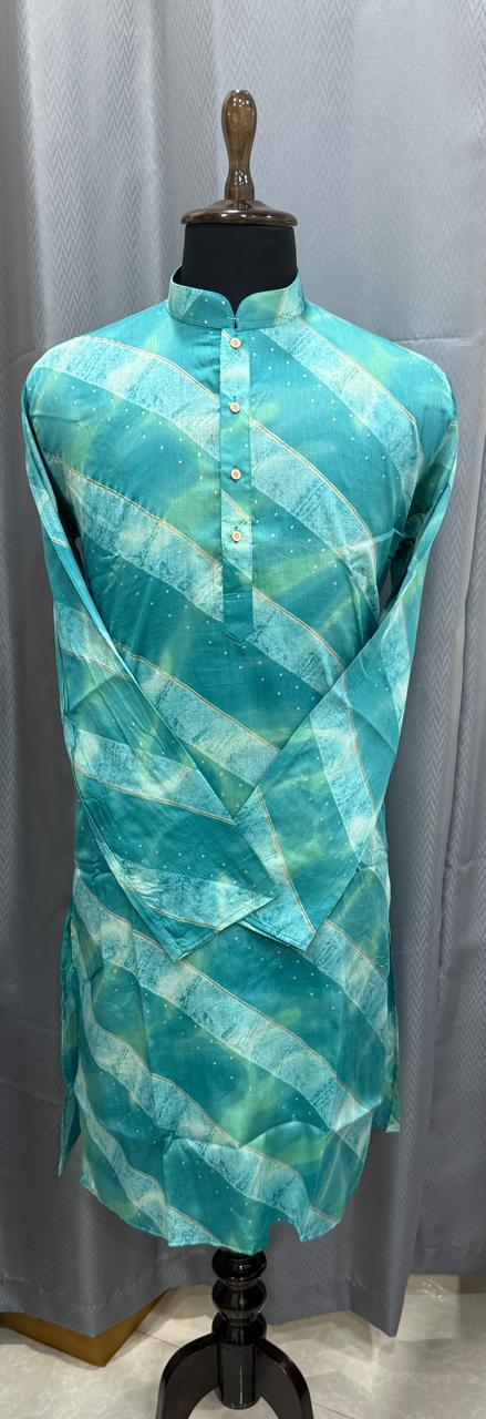 Turquoise and green patterned dress on a mannequin against a gray background